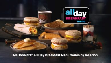 A group of sandwiches and a drink on a table, representative of McDonald's all day breakfast which is no longer served