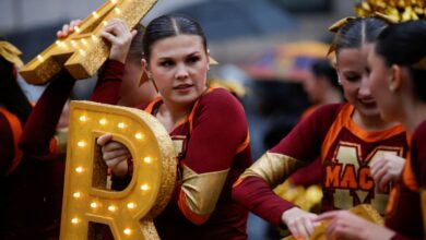 Performers, including a group of cheerleaders holding up letters, preparing for the annual Macy's Thanksgiving Day Parade in Manhattan, New York City on November 28, 2024.