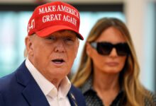 Donald Trump and Melania Trump walk after voting on Election Day