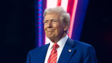 President-elect Donald Trump smiling at Turning Point USA's AmericaFest in Phoenix Convention Center, Arizona