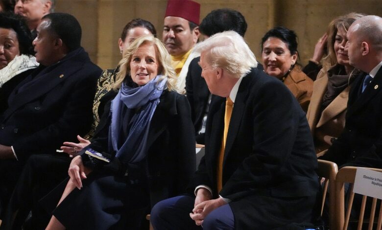 First Lady Jill Biden (CL) speaks with President-elect Donald Trump during a ceremony to mark the re-opening of the landmark Notre Dame Cathedral in central Paris on December 7, 2024. 