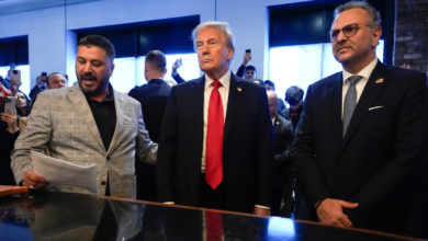 President Donald Trump, center, listens to Albert Abbas, owner of The Great Commoner, left, as Massad Boulos looks on