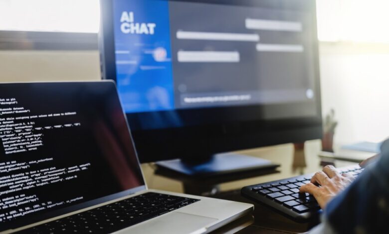 Programmer using generative artificial intelligence for software development, typing on a keyboard in an office setting