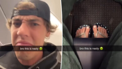 Plane passenger who won't move feet gets 'instant karma': video