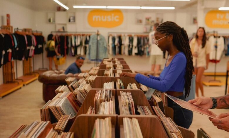 Shoppers in Mids Market, a vintage store in Little River, Florida, run by AJ Capital.