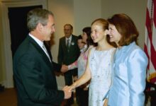 President George W. Bush shaking hands with Elizabeth Smart and her mother Lois Smart in the Roosevelt Room at the White House, signing of the S. 151, PROTECT Act of 2003.