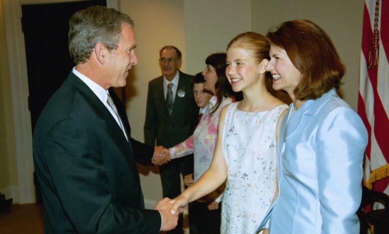 President George W. Bush shaking hands with Elizabeth Smart and her mother Lois Smart in the Roosevelt Room at the White House, signing of the S. 151, PROTECT Act of 2003.