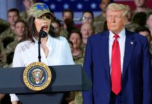 President Donald Trump listens as Michigan Gov. Gretchen Whitmer speaks to members of the Michigan National Guard at Selfridge Air National Guard Base, Tuesday, in Harrison Township, Mich.