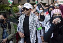 Mohsen Mahdawi, center, looks on during an anti-Israel protest at Columbia University on Oct. 12, 2023, in New York.