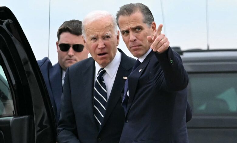 President Joe Biden talks with his son Hunter Biden upon arrival at Delaware Air National Guard Base in New Castle, Delaware, on June 11, 2024, as he travels to Wilmington, Delaware.
