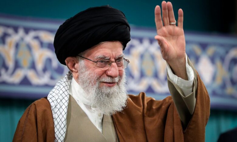 Iranian Supreme Leader Ayatollah Ali Khamenei waving to the crowd during a meeting in Tehran, Iran
