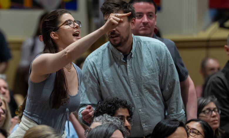 An attendee shouts at Rep. Alexandria Ocasio-Cortez (D-NY) during a town hall gathering about her stance on the Israel / Palestine conflict on May 2, 2025 in New York City.