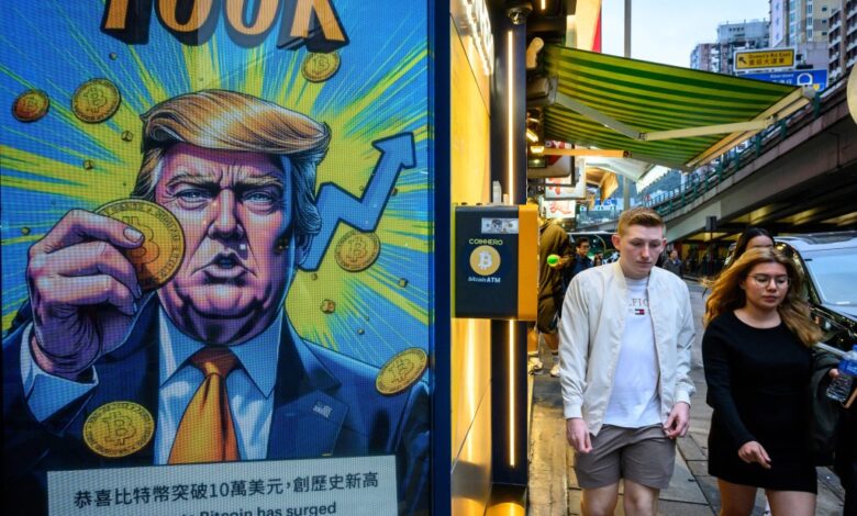 Cryptocurrency exchange office in Hong Kong with a screen featuring President Trump holding cryptocurrency coins.