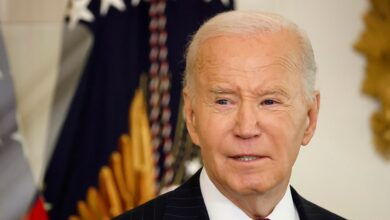 Biden in front of flag