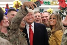 President Donald Trump and first lady Melania Trump greet military personnel in the dining facility during an unannounced visit to Al Asad Air Base in Iraq on Dec. 26, 2018.
