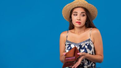 young woman holding empty wallet
