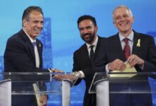 Democratic mayoral candidates Andrew Cuomo, left, shakes hands with Zohran Mamdani, center, as Whitney Tilson reacts after participating in a Democratic mayoral primary debate, Wednesday, June 4, 2025, in New York.