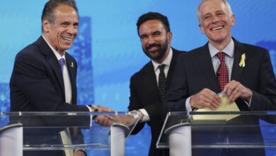 Democratic mayoral candidates Andrew Cuomo, left, shakes hands with Zohran Mamdani, center, as Whitney Tilson reacts after participating in a Democratic mayoral primary debate, Wednesday, June 4, 2025, in New York.