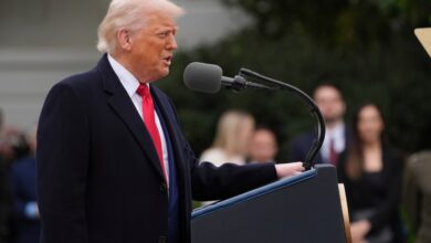 Donald Trump speaking at a podium.