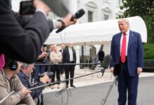 President Donald Trump, from right, speaks with reporters as White House Deputy Chief of Staff Stephen Miller and White House press secretary Karoline Leavitt listen before departing the White House on his way to attend the G7 Summit in Canada, Sunday, June 15, 2025, in Washington.