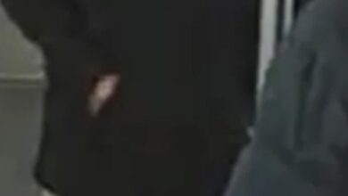 Luis Pallchisaca, a 21-year-old male, wearing a black Champion hoodie and light-colored camouflage pants.