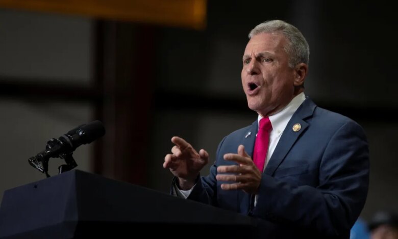 U.S. Representative Buddy Carter (R-GA) speaking at a Republican political event.