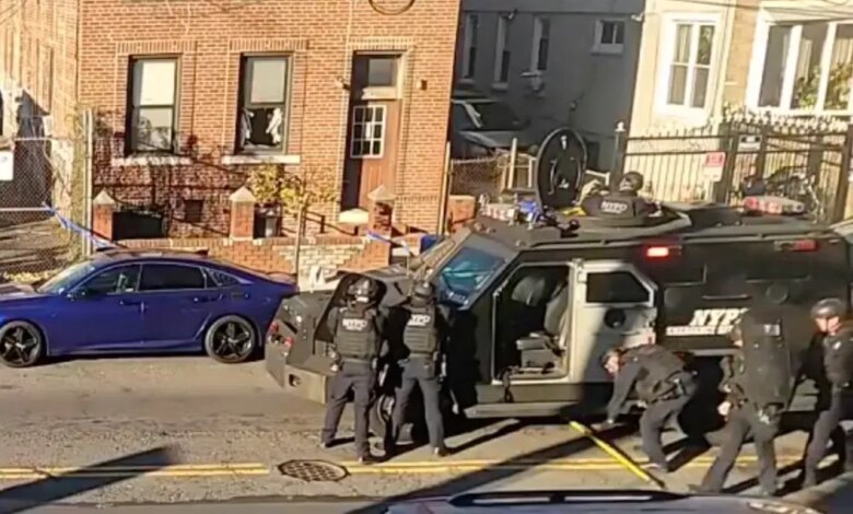 Police barricade a Brooklyn apartment with an armored vehicle after shots were fired.