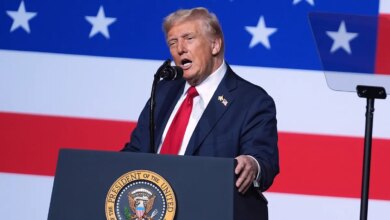 Donald Trump speaking to military senior leaders with American flag backdrop