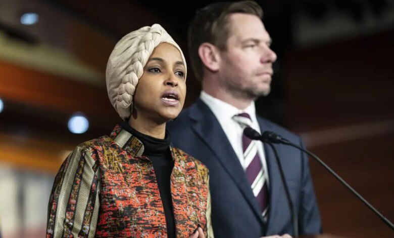 Ilhan Omar stands with Eric Swalwell.