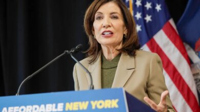 Governor Kathy Hochul speaking at a podium with "AFFORDABLE NEW YORK" written on it.