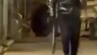 The man struck the victim in the face with a black baseball bat.