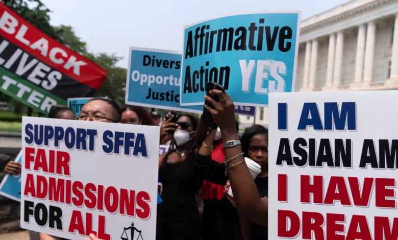 Protesters hold signs saying "Affirmative Action YES" and "Support SFFA Fair Admissions For All" outside a building.