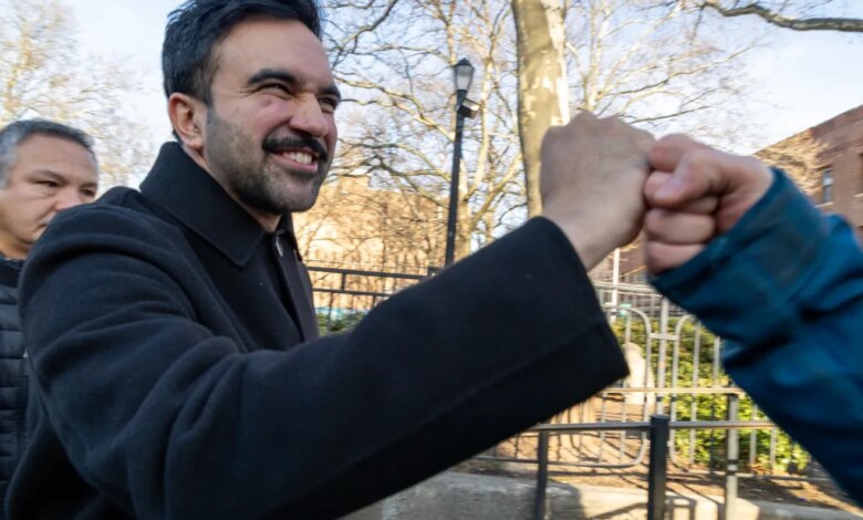 Zohran Mamdani fist-bumping a supporter.