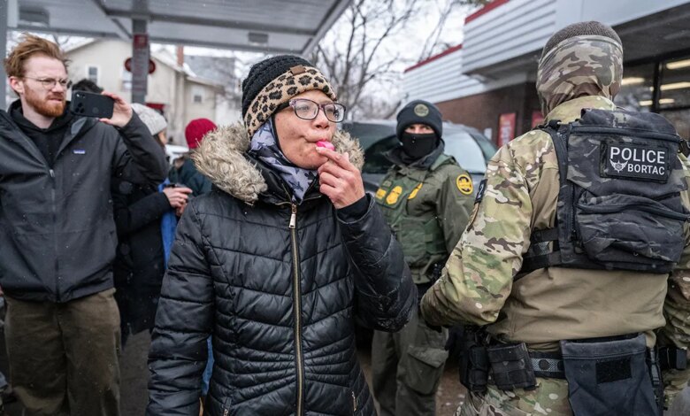 Woman blows whistle at ICE.
