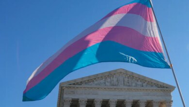 Transgender pride flag waving above the US Supreme Court building.
