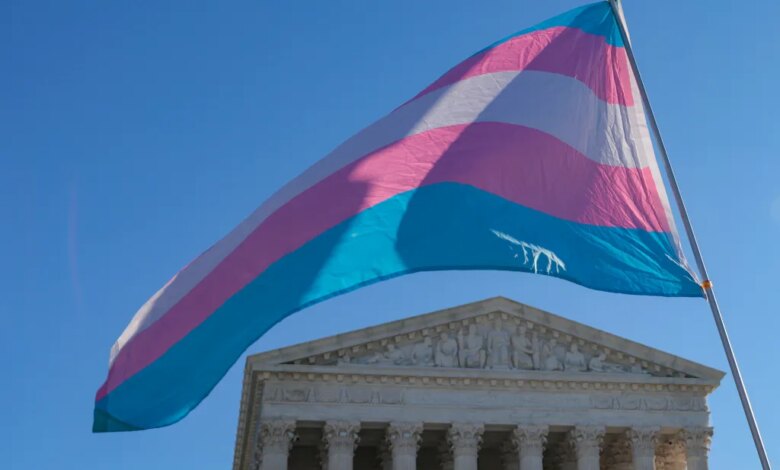 Transgender pride flag waving above the US Supreme Court building.