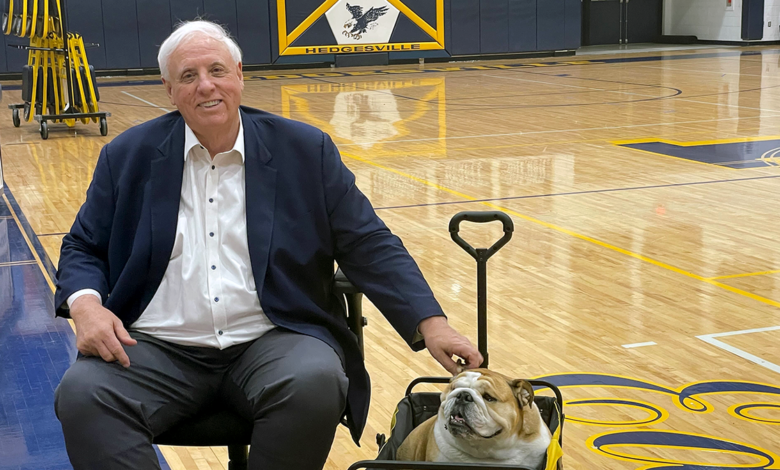 Jim Justice on basketball court with Babydog