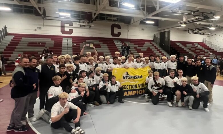 Massapequa wrestling team celebrates their Nassau County championship.
