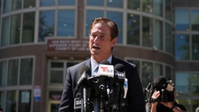 Los Angeles County District Attorney Nathan Hochman speaks to reporters outside the courthouse.