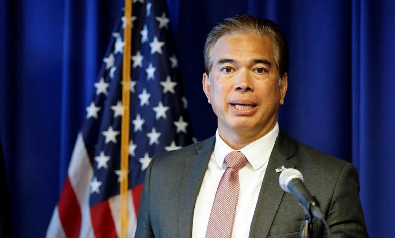 Rob Bonta speaking in front of American flag