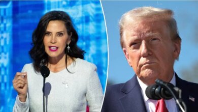 Michigan Democrat Gov. Gretchen Whitmer stands to the left of President Donald Trump