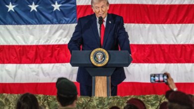 Donald Trump speaking at a podium with the Seal of the President of the United States, in front of an American flag.