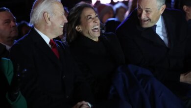 (L-R) President Joe Biden, Vice President Kamala Harris and Second Gentleman Doug Emhoff laugh together as they attend the National Christmas Tree lighting on the Ellipse on November 30, 2022 in Washington, DC.