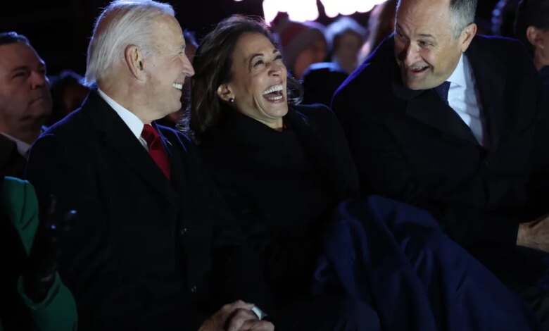 (L-R) President Joe Biden, Vice President Kamala Harris and Second Gentleman Doug Emhoff laugh together as they attend the National Christmas Tree lighting on the Ellipse on November 30, 2022 in Washington, DC.