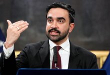 NYC Mayor Zohran Mamdani speaks at a podium.