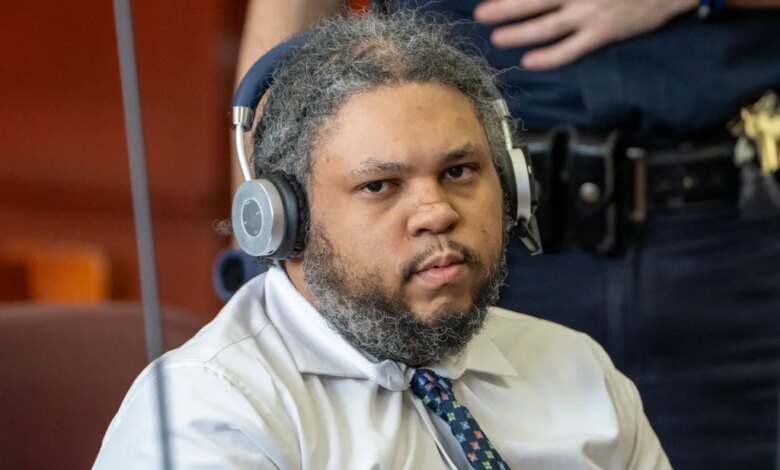 Randy Santos in a light-colored button-up shirt and patterned tie with headphones, seen during his trial.