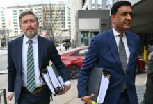 US Representatives Thomas Massie and Ro Khanna arriving at a Department of Justice office.