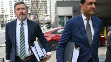 US Representatives Thomas Massie and Ro Khanna arriving at a Department of Justice office.