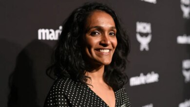 Nithya Raman smiling on a red carpet.