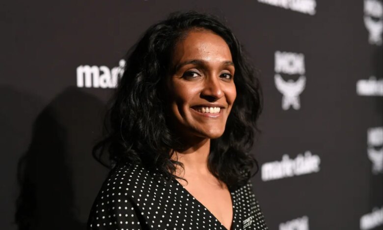 Nithya Raman smiling on a red carpet.